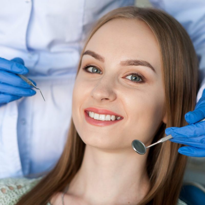 Dentist examining a patient's teeth