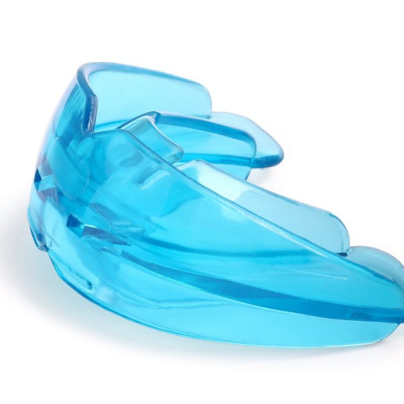 Transparent dental mouth guard isolated on white. Bite correction